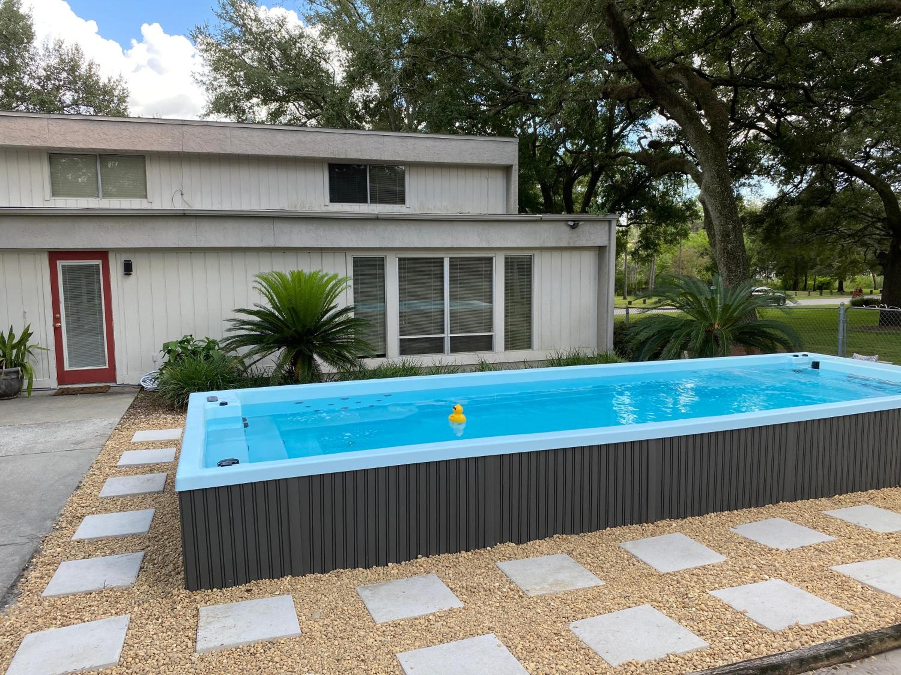 Reel relaxing across from River in Huge 24 foot Swim Spa — 3