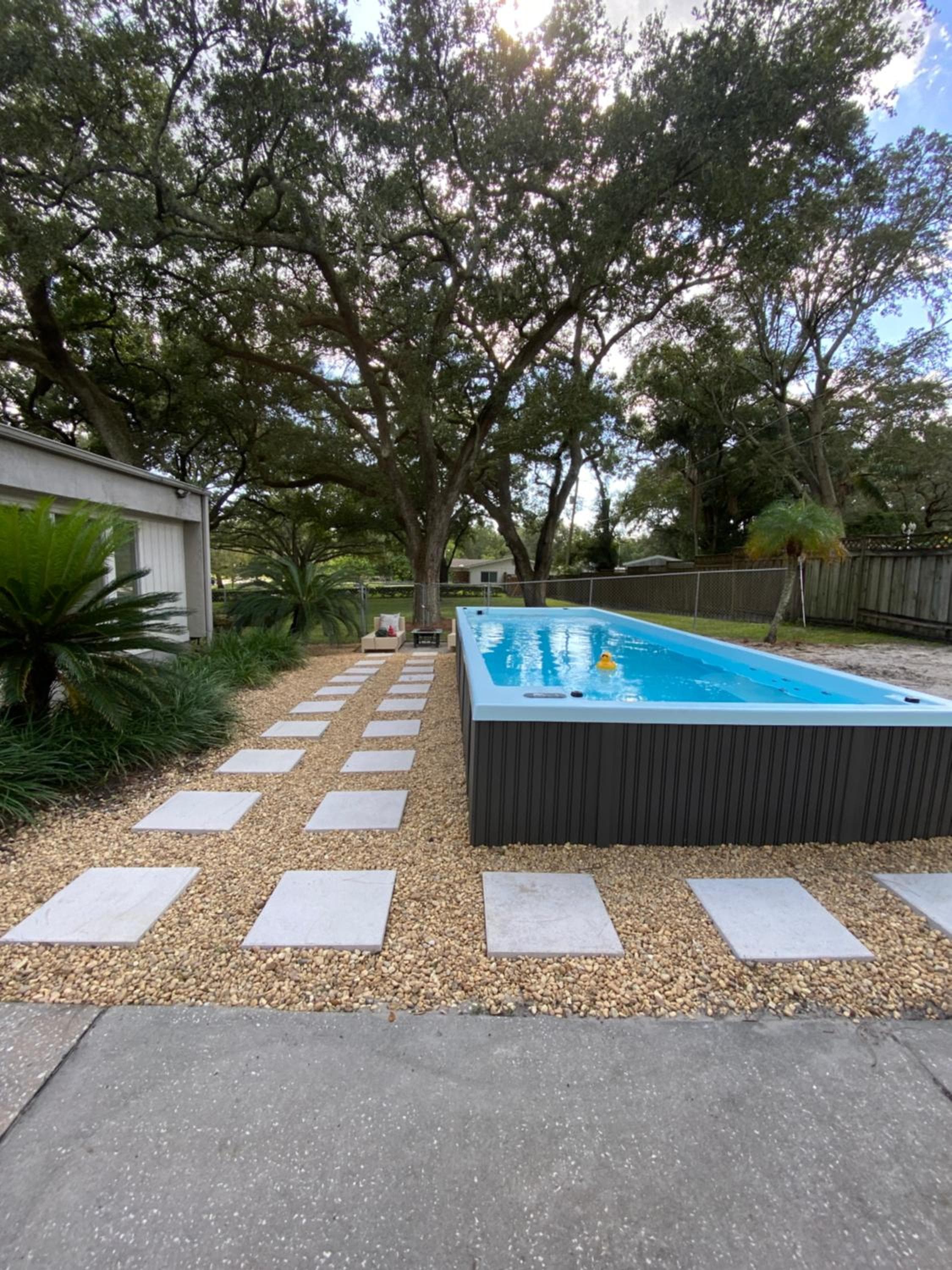 Reel relaxing across from River in Huge 24 foot Swim Spa — 2