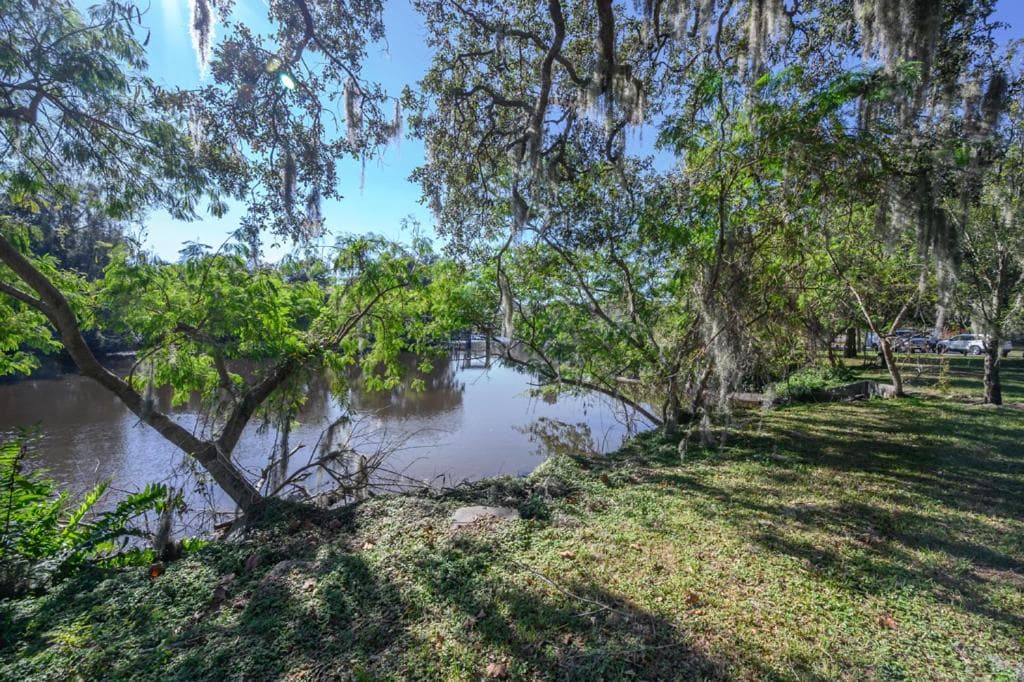 Reel relaxing across from River in Huge 24 foot Swim Spa — 7